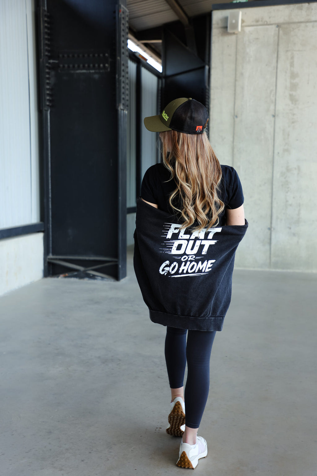 Khaki baseball cap with flat out or go home text and adjustable back closure