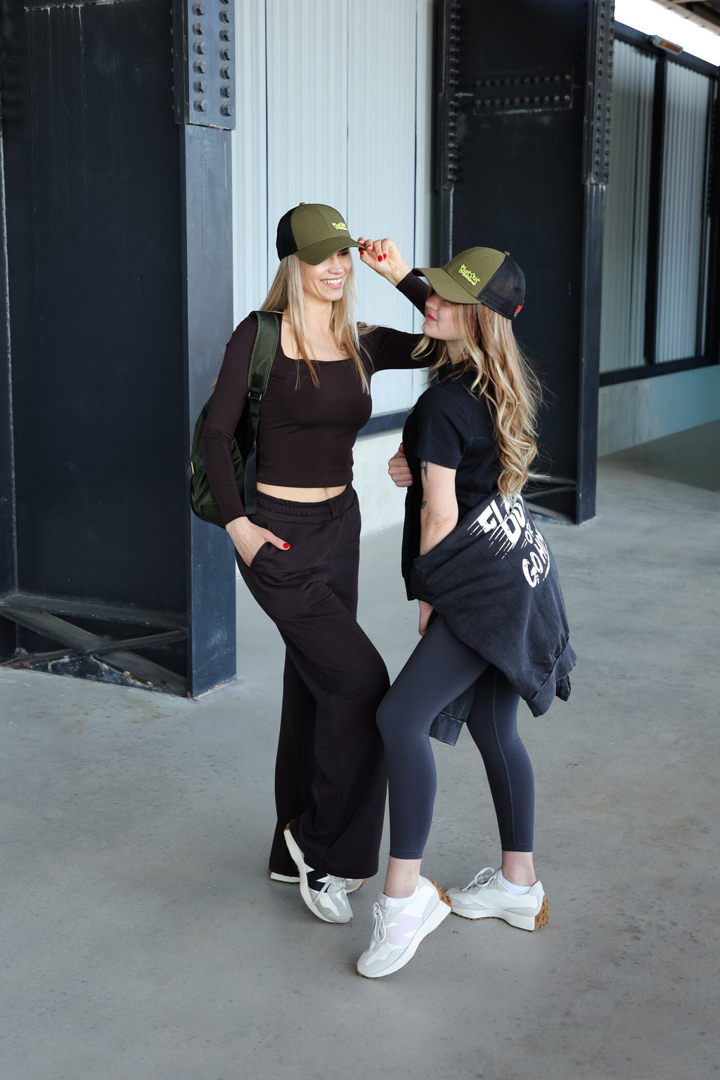 Khaki baseball cap with flat out or go home text and adjustable back closure