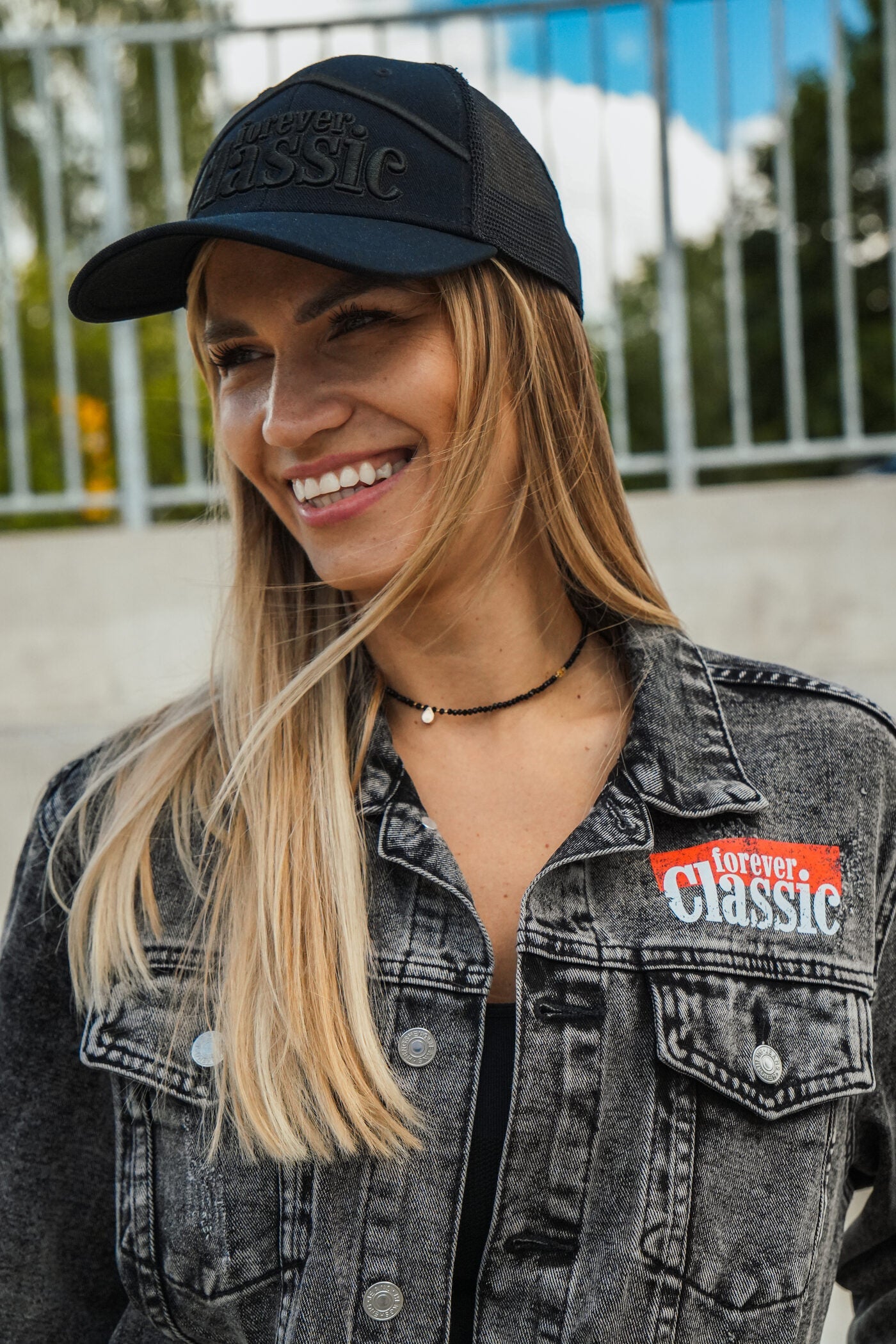 Forever Classic black unisex denim jacket with logo on front and back, button closure and pockets