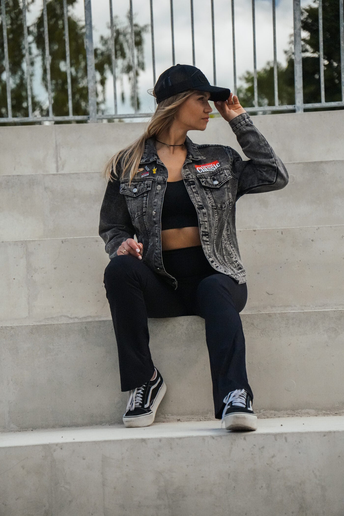 Forever Classic black unisex denim jacket with logo on front and back, button closure and pockets