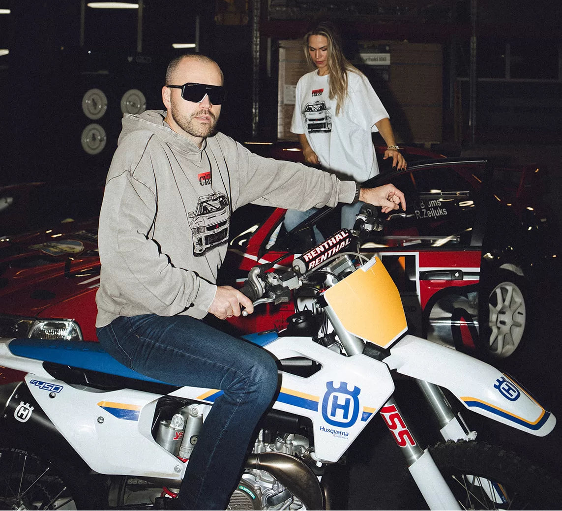 Rider on a Husqvarna enduro bike with the Forever Classic team in the garage